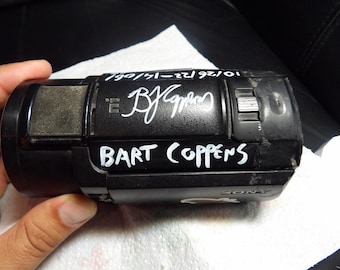 Fan Collectible: Broken legacy camera (used 2022-2024) by Bart Coppens; signed. Used in Brazil and Uganda.  (Note, irreparable!) FDR AX43A