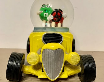 M&M  Yellow Hot Rod with Red and Green in a water globe in excellent condition