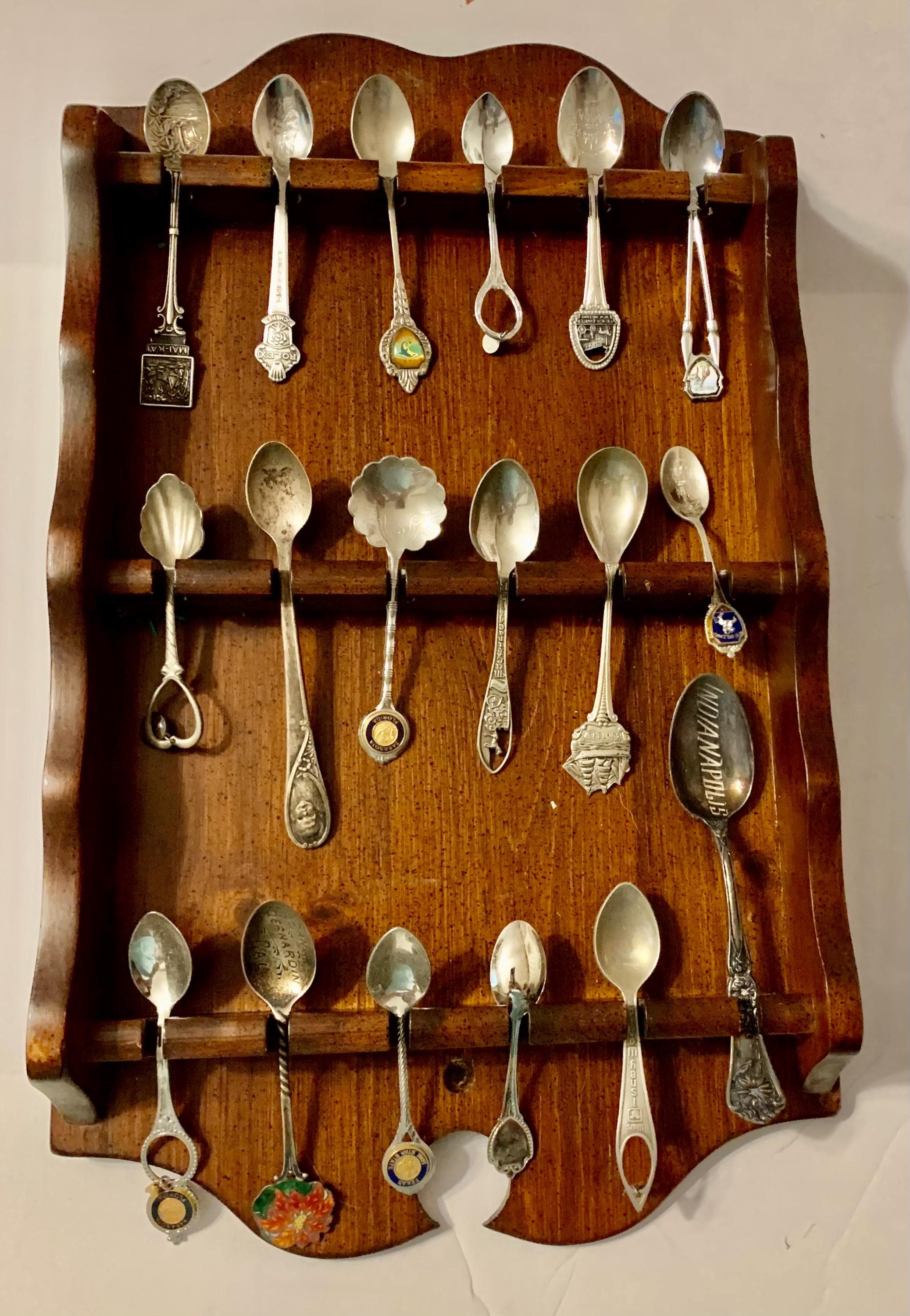Souvenir 18 piece spoon collection with matching rack, part of what my mother left behind. Seeking good home