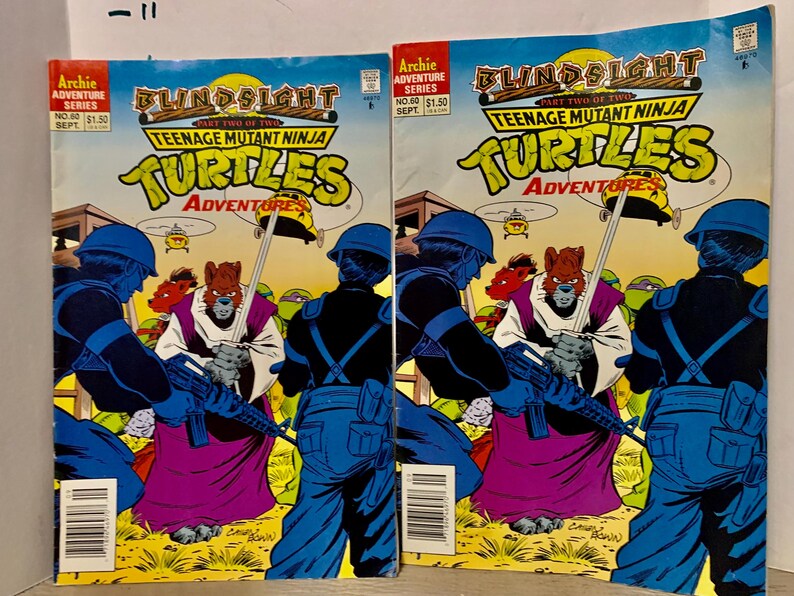 May include: Two comic book covers featuring Teenage Mutant Ninja Turtles. The covers are blue and green with the title "Blindsight" and "Teenage Mutant Ninja Turtles Adventures".