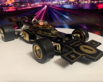 Emerson Fittipaldi 1973 Lotus John Player Special F1 Car Model 1:18 Scale Model. The #1 on the car show he the defending champion. Ship free