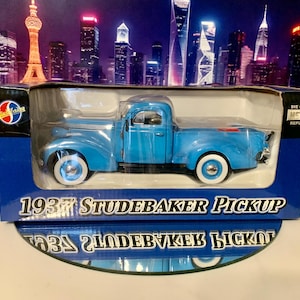 1:24 scale model of a 1937 Studebaker pickup by NAPA. It is still  in the original box. It’s a real Beauty! I’ll ship it free within the US