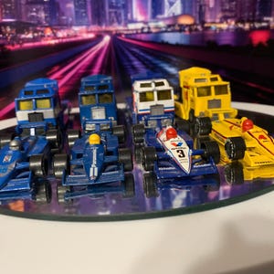 4 Vintage 1983 Matchbox Indy Cars with their transporters. You don’t see these very often! Free domestic shipping is provided