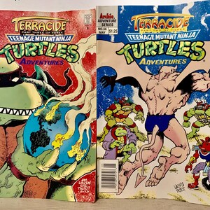 May include: Two Teenage Mutant Ninja Turtles comic books, both featuring the title "Terrace", part three of three and part two of three. The covers feature the Turtles in action, with one cover showing a turtle holding a globe and the other showing a turtle fighting a creature with wings.