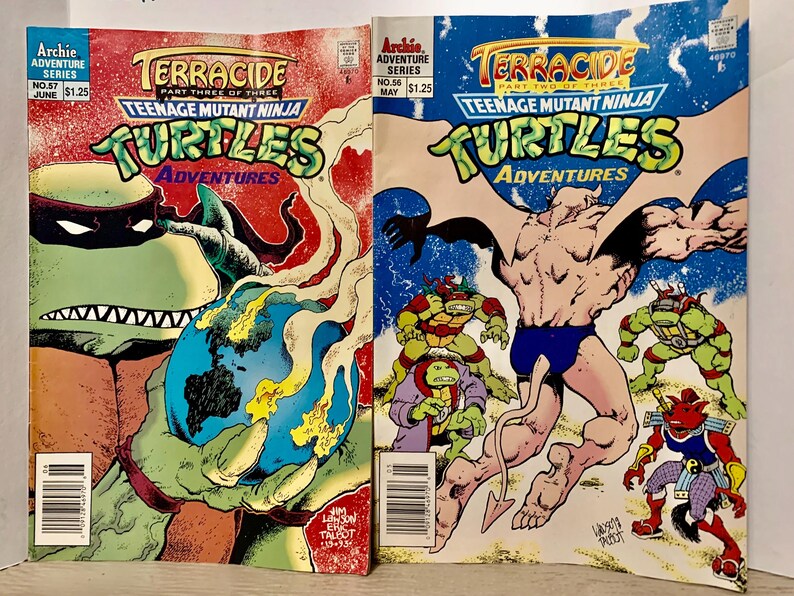 May include: Two Teenage Mutant Ninja Turtles comic books, both featuring the title "Terrace", part three of three and part two of three. The covers feature the Turtles in action, with one cover showing a turtle holding a globe and the other showing a turtle fighting a creature with wings.