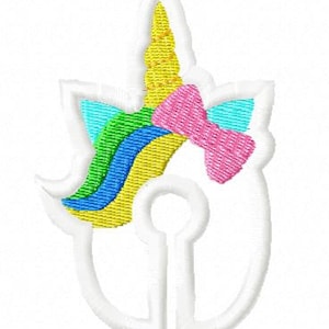 May include: White embroidered patch with a unicorn design. The unicorn has a yellow horn, a pink bow, and a rainbow mane.