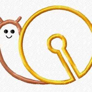 May include: An embroidered design featuring a cartoon snail with a brown body and a golden shell. The snail has a smiling face with black eyes and a curved mouth. The shell is a keyhole shape.