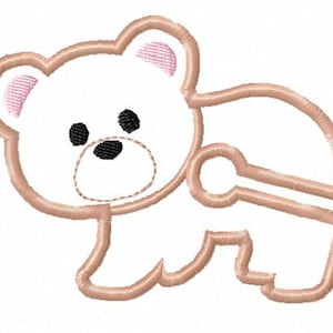 May include: An embroidered design of a teddy bear in a walking pose. The bear is white with a light brown outline and pink inner ears. It has black eyes and a black nose. The design is likely for a baby or child's item.