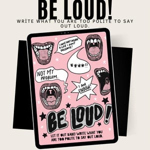 May include: A pink tablet with the words "BE LOUD!" in bold black letters. The tablet features speech bubbles with phrases like "I AM ENOUGH!" and "NOT MY PROBLEM." The phrase "WRITE WHAT YOU ARE TOO POLITE TO SAY OUT LOUD" is also included.