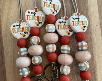 Boho Earthy Cozy Warm neutrals rust and plaid In My Teacher Era silicone and beechwood beaded stretchy Lanyard for keys and badge!