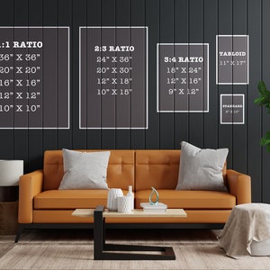 May include: A living room interior with a brown leather sofa, a coffee table, and two side tables. The wall behind the sofa is dark gray and has white frames with text indicating different print sizes and ratios. The text includes: 1:1 Ratio, 2:3 Ratio, 3:4 Ratio, Tabloid, and Standard.