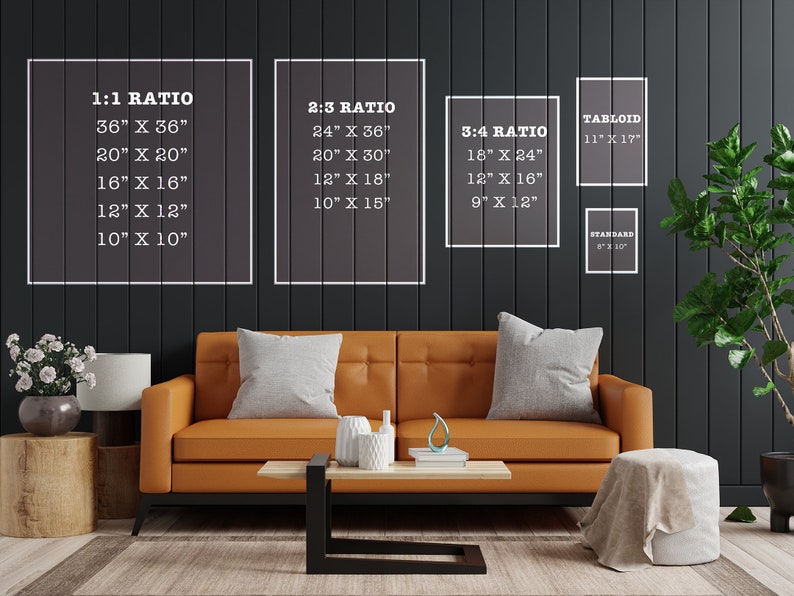 May include: A living room interior with a brown leather sofa, a coffee table, and two side tables. The wall behind the sofa is dark gray and has white frames with text indicating different print sizes and ratios. The text includes: 1:1 Ratio, 2:3 Ratio, 3:4 Ratio, Tabloid, and Standard.