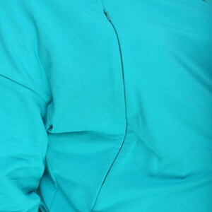 Maternity & Nursing Oversize Sweatshirt PDF Pattern + Sewing Video Tutorial, Hidden Chest Zippers for Breastfeeding sizes S-3XL with VIDEO tutorial.

The sweatshirt is designed for pregnant and nursing mothers. It features invisible zippers in the princess seams on the front, long sleeves, neckline is hemmed with facing. Sew your own stylish maternity and nursing sweatshirt. Easy. Comfortable. Beginner-friendly.

It’s essential to have comfortable clothes during maternity and lacta-tion periods.