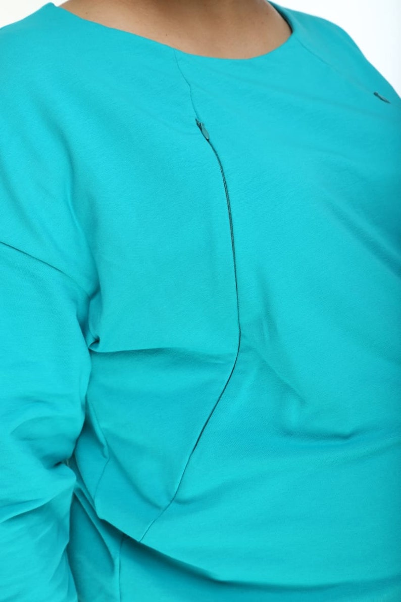 Maternity & Nursing Oversize Sweatshirt PDF Pattern + Sewing Video Tutorial, Hidden Chest Zippers for Breastfeeding sizes S-3XL with VIDEO tutorial.

The sweatshirt is designed for pregnant and nursing mothers. It features invisible zippers in the princess seams on the front, long sleeves, neckline is hemmed with facing. Sew your own stylish maternity and nursing sweatshirt. Easy. Comfortable. Beginner-friendly.

It’s essential to have comfortable clothes during maternity and lacta-tion periods.