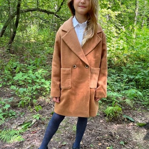 Kids Coat PDF Sewing Pattern – Sizes 7-14 Years + Video Sewing Tutorial

Sew a stylish and warm coat for your child with this easy-to-follow Kids Coat PDF Sewing Pattern! Designed for children aged 7 to 14 years, this pattern includes all necessary sizes and comes with a step-by-step video tutorial, making it beginner-friendly. Perfect for cozy outerwear made from wool, softshell, or rainproof fabrics. Print at home (A4/US Letter) or in A0 format.