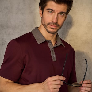 Men's Polo Shirt PDF Sewing Pattern | Sizes S–5XL Sew a classic men's polo shirt with a sharp contrast collar and placket, short sleeves, and a comfortable, true-to-size fit. This everyday essential works in soft jersey or pique knit for a polished, ready-to-wear look — perfect for building a custom wardrobe or sewing thoughtful handmade gifts.

With a full step-by-step video tutorial included, you'll get a clean, professional finish — even as a beginner.