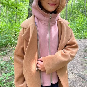 Kids Coat PDF Sewing Pattern – Sizes 7-14 Years + Video Sewing Tutorial

Sew a stylish and warm coat for your child with this easy-to-follow Kids Coat PDF Sewing Pattern! Designed for children aged 7 to 14 years, this pattern includes all necessary sizes and comes with a step-by-step video tutorial, making it beginner-friendly. Perfect for cozy outerwear made from wool, softshell, or rainproof fabrics. Print at home (A4/US Letter) or in A0 format.