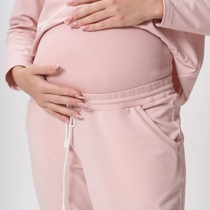 Maternity Sewing Pattern PDF | Nursing Top + Pregnancy Pants Bundle S-3XL | PDF + Video Tutorial 

Maternity Bundle PDF Sewing Pattern | Sizes S–3XL Sew a complete maternity set — a relaxed raglan-sleeve top with nursing-friendly seam access, paired with comfortable elastic drawstring pregnancy pants. Designed to grow with your bump and stay comfortable through every stage, this soft, easy-fit set is perfect for everyday wear, lounging, or nursing after baby arrives.