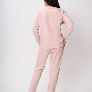 Maternity Nursing Sweatshirt Sewing Pattern PDF | Raglan Sleeve Nursing Top S-3XL | PDF + VIDEO tutorial.
 Sew a soft, relaxed raglan-sleeve sweatshirt with built-in zip nursing access — comfortable enough to wear throughout pregnancy and practical enough to keep using after baby arrives. A true two-in-one wardrobe staple that grows with you.

With a full step-by-step video tutorial included, you'll get a clean, professional finish — even as a beginner.