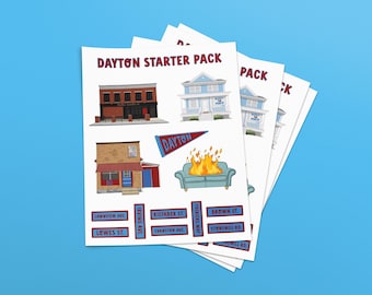 May include: A set of four printable stickers featuring illustrations of buildings and street signs with the text "DAYTON STARTER PACK". The stickers feature a red brick building, a blue house, a brown building with a red awning, a couch on fire, and street signs with the names of streets in Dayton, Ohio.