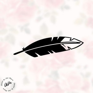 May include: A black feather decal with a detailed design. The feather is set against a soft, floral background. The decal is a simple, yet elegant design, perfect for adding a touch of nature to any surface. The text "Decals by Ash Marie" is in the lower left corner.