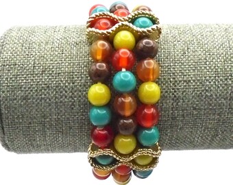 Vintage Bracelet with 3 Strands of Multi-Colored Beads held together by 4 Gold Accents