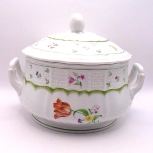 May include: White porcelain soup tureen with a lid, featuring a floral design with a large orange tulip. The tureen has two handles and a green trim.