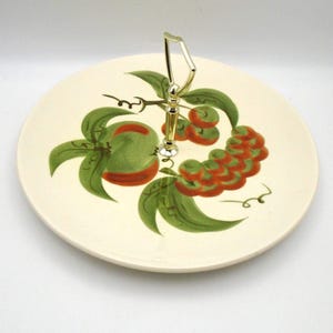 May include: A set of three ceramic mugs with a speckled, matte finish. The mugs are in shades of cream, light gray, and dark gray. Each mug has a simple, minimalist design, perfect for coffee or tea.