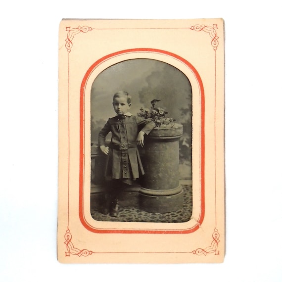 Vintage Tintype of Young Child Leaning on Post/Pedestal in original paper frame