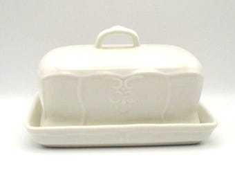 Vintage Versailles Tabletops Unlimited White Ceramic Covered Butter Dish, Featuring Embossed Fleur-de-lis and Flower Motif, French-Inspired