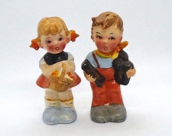 Vintage Salt & Pepper Boy carrying Wood and Girl with Flower Basket (Hummel Style)