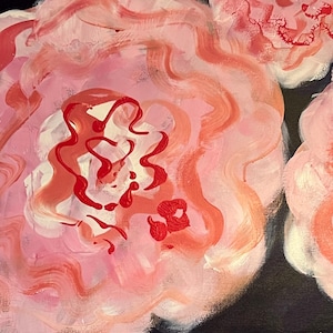 May include: An abstract painting featuring three large, stylized flowers in shades of pink and red against a dark blue background. The flowers have layered petals and a textured appearance, with a focus on the central details.