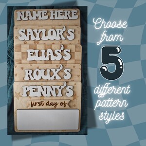 May include: Wooden sign with five different patterns, each with a name in white letters. The sign says "NAME HERE", "SAYLOR'S", "ELIAS'S", "ROUX'S", and "PENNY'S". The bottom sign has a blank space for writing "first day of".