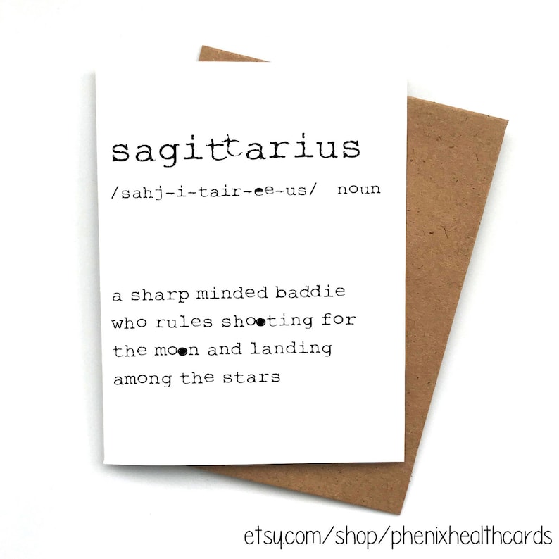 May include: A white card with black text defining the word "Sagittarius" as a "sharp minded baddie who rules shooting for the moon and landing among the stars".