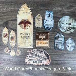 11 étiquettes de potions sur le thème noyau de baguette/phénix/dragon imprimées sur du papier autocollant et découpées