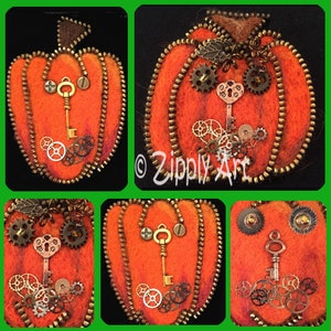 May include: Orange felt pumpkin with a brass zipper, key, and gears. The pumpkin has a steampunk aesthetic, with a key and gears forming a face. The design includes a brown stem and is set against a black background.