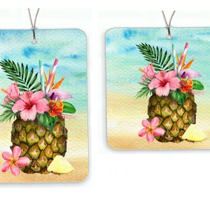 May include: A watercolor painting of a pineapple with tropical flowers and leaves. The pineapple is on a beach with a blue sky and ocean in the background.