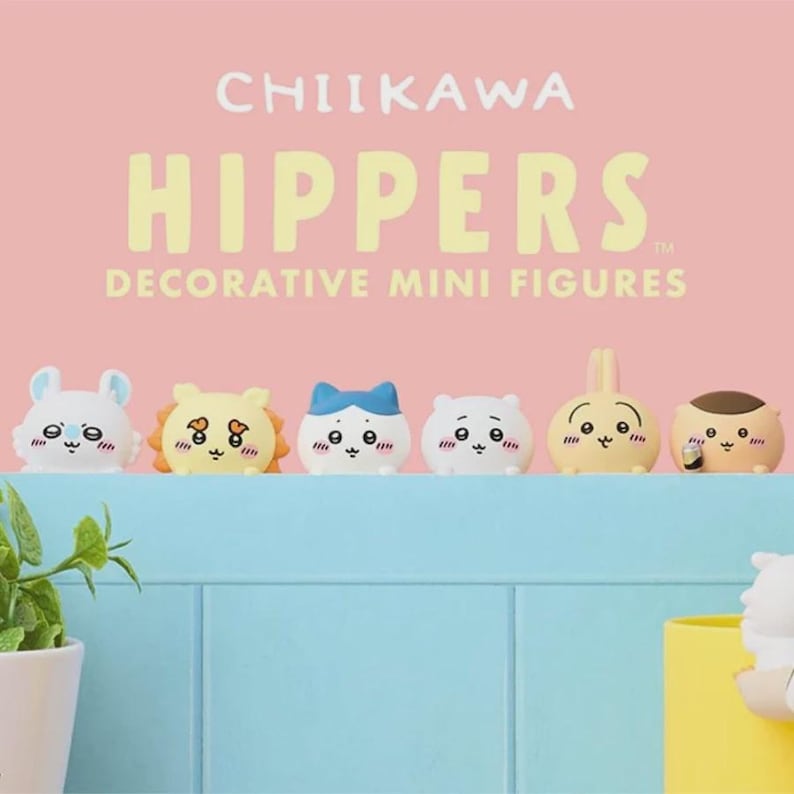 May include: A collection of six decorative mini figures, each with a unique animal-like design. The figures are in various colors, including white, yellow, and brown, and are arranged on a blue surface against a pink background. The text "CHIIKAWA HIPPERS" is displayed above.