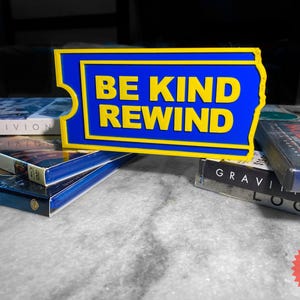 Be Kind Rewind Sign — Retro VHS Ticket Decor for Nostalgic Spaces