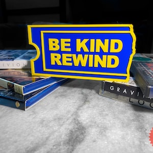 Placa de decoração Blockbuster Video BE KIND REWIND