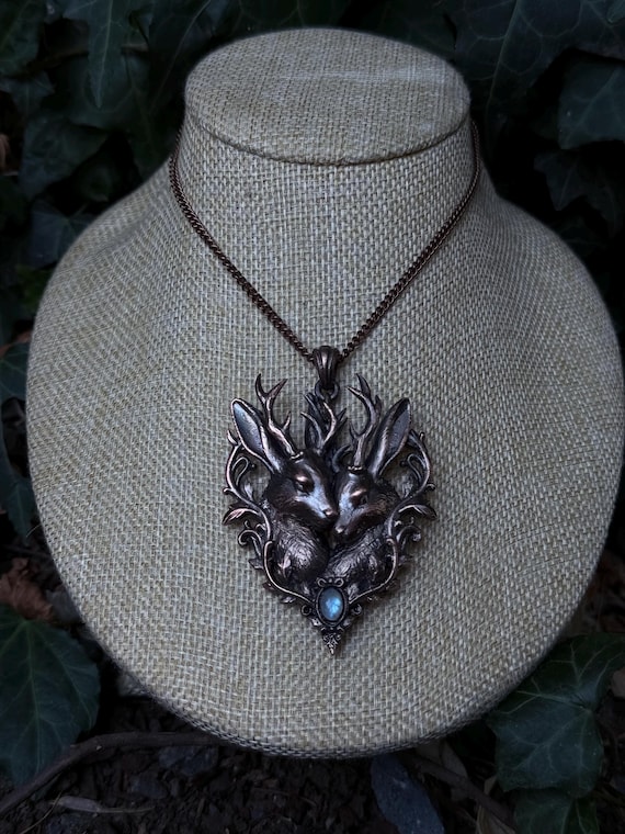 A hand-sculpted jackalope — the mythical rabbit-antelope cryptid — electroformed in copper with moonstone: genuinely weird, one-of-a-kind wearable art you won't find anywhere else.