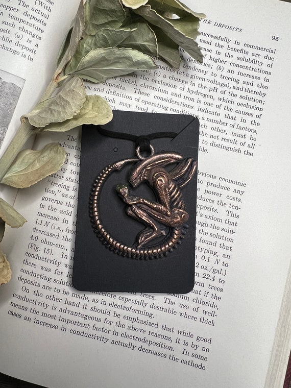 Electroformed copper transforms a Xenomorph queen into wearable sci-fi art — the organic-metallic texture of electroforming makes each one genuinely one-of-a-kind.