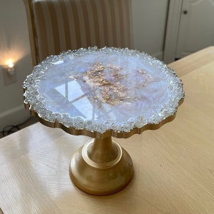 Iridescent white opal tray stand with gold pedestal base, decorative centerpiece display, custom tray with reflective glass rim, handmade