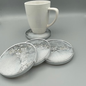 4” round white and silver coaster sets made of resin, silver and white decor, handmade resin coasters with silver accents