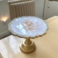 Iridescent white opal tray stand with gold pedestal base, decorative centerpiece display, custom tray with reflective glass rim, handmade