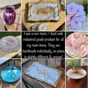 May include: Assortment of resin trays and coasters in various colors and patterns, including blue, white, pink, and purple. Some trays feature gold accents. The text "I use a non-toxic / food safe industrial grade product for all my resin items. They are handmade individually, so piece is slightly different & unique!" is visible in the image.