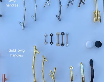 May include: Assortment of cabinet hardware, including silver and gold twig handles, black and gold pulls, and a gold arrow.  The text "Silver twig handles" and "Gold twig handles" is visible in the image.