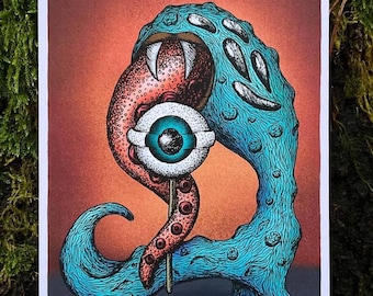 May include: A blue monster with a large mouth and sharp teeth is holding a lollipop with an eyeball on top. The lollipop is on a stick and the monster is standing on a dark blue background.