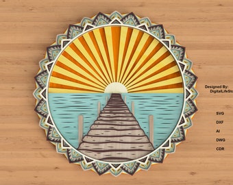 May include: A circular design with a mandala border, featuring a sun setting over a wooden pier with a blue ocean. The sun is yellow and orange, and the pier is brown. The ocean is a light blue color. The mandala border is a mix of brown, blue, and white.