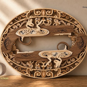 May include: An oval-shaped wooden wall art piece featuring two layered flintlock pistols centered within an intricate, laser-cut filigree frame. The design includes the text "Designed by: DigitalLifeStore" and file formats SVG, DXF, AI, DWG, CDR.
